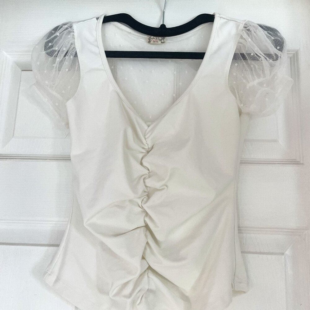 Beautiful white Free People top with sheer details